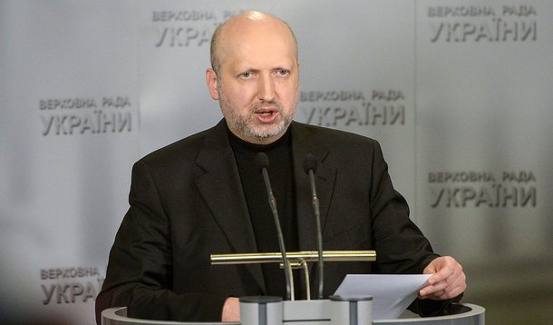 Ukrainian parliament speaker Oleksandr Turchynov answers media questions after an urgent parliament session in Kiev, Ukraine, Sunday, March 2, 2014. Ukraine's new prime minister urged Russian President Vladimir Putin to pull back his military Sunday in th