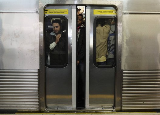 Commuters ride a subway train during rush hour in downtown Sao Paulo May 28, 2013. The metropolitan area of some 20 million people has only about 45 miles (72 km) of mostly underground rail. Sao Paulo has some of the world's worst traffic jams, with commu