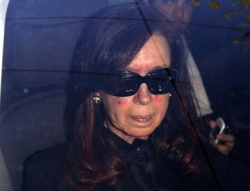 Argentina's President Cristina Fernandez sits in a car as she arrives at hospital in Buenos Aires October 7, 2013. Fernandez will undergo surgery on Tuesday to treat a head injury, sidelining her ahead of a key mid-term election and at the apex of a bitte