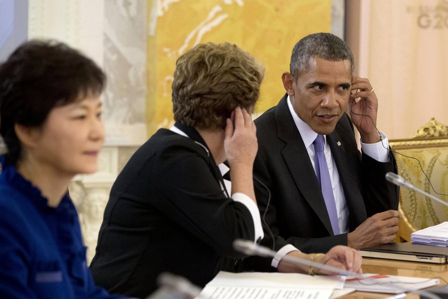 U.S. President Barack Obama (R) sits next to Brazilian President Dilma Rousseff (C) during the start of the G20 Working Session at the Konstantin Palace in St. Petersburg, September 5, 2013. Seen at far left is South Korean President Park Geun-hye.  REUTE