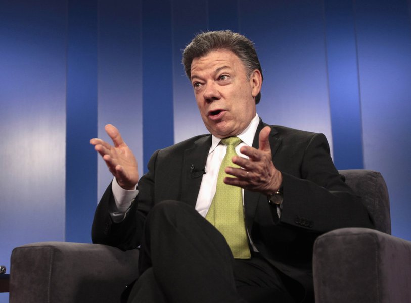 Colombia's President Juan Manuel Santos speaks during a Reuters interview at the presidential palace in Bogota August 8, 2013. Colombia's FARC rebel leaders negotiating peace with the government must return to the jungles and end their days on the battlef