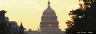 The United States Capitol dome is seen down Pennsylvania Avenue in Washington September 30, 2013. With a deadline to avert a federal government shutdown fast approaching, the U.S. Capitol was eerily quiet on Sunday as Republicans and Democrats waited for 