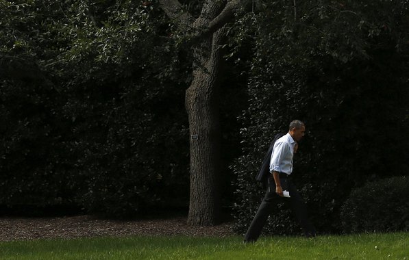 U.S. President Barack Obama walks to the Oval Office of the White House  in Washington October 14, 2013. A meeting between Obama and congressional leaders to discuss progress toward a deal to re-open the government and raise the U.S. debt ceiling has been