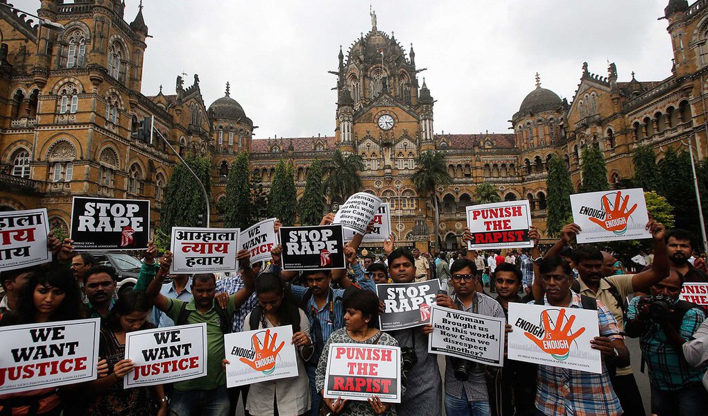 Journalists hold placards as they participate in a protest march against the rape of a photo journalist by five men inside an abandoned textile, in Mumbai August 23, 2013. The attack on Thursday night triggered protests and an outcry on social media, with