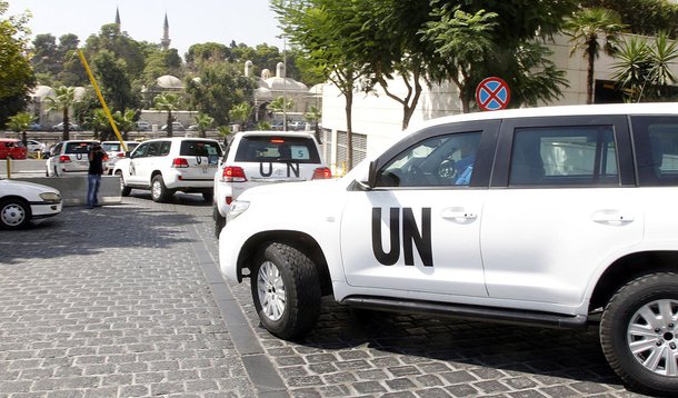 United Nations (U.N.) vehicles transport a team of U.N. chemical weapons experts to the scene of a poison gas attack outside the Syrian capital last week, in Damascus August 26, 2013. The experts dressed in blue U.N. body armour, left in a six-car convoy,
