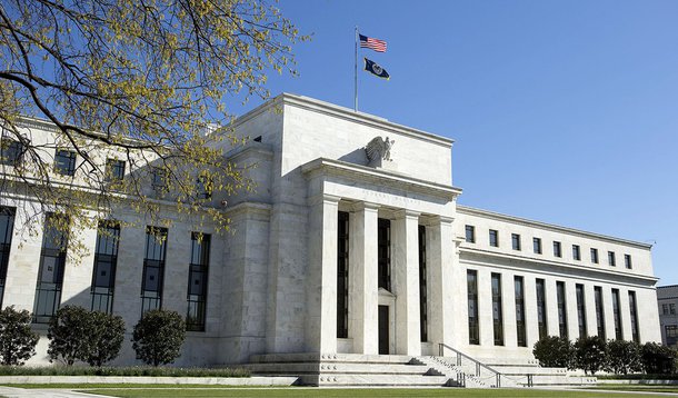 The Federal Reserve Building stands in Washington April 3, 2012. Investors are awaiting minutes from the U.S. Federal Open Market Committee's March 13 meeting that may provide clues on any potential quantitative easing.  REUTERS/Joshua Roberts  (UNITED ST