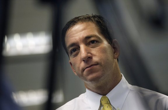 FILE - In this June 11, 2013, file photo Britain's The Guardian newspaper reporter Glenn Greenwald talks to The Associated Press in Hong Kong. Greenwald first reported former NSA contractor Edward Snowden's disclosure of NSA's government surveillance prog