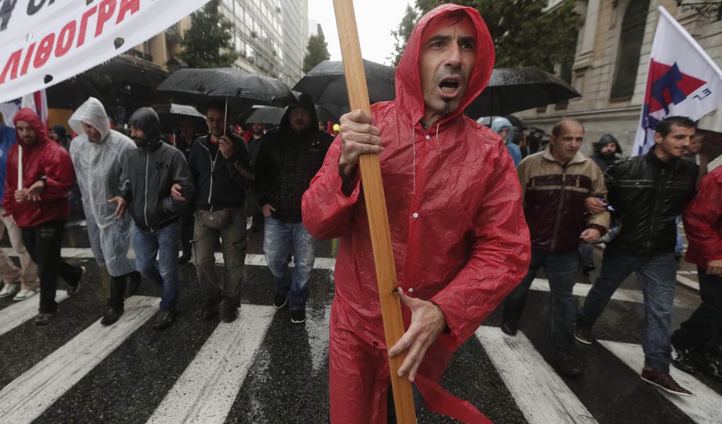 Protesters from the Communist-affiliated trade union PAME march during a general 24 hour labour strike in Athens November 6, 2013. Greek schools shut and flights were disrupted as workers held a general strike on Wednesday to protest austerity imposed by 