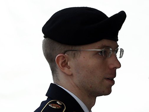 U.S. soldier Bradley Manning is escorted into court to receive his sentence at Fort Meade in Maryland August 21, 2013. Manning, who was convicted of the biggest breach of classified data in the nation's history, will be told on Wednesday how much of his l
