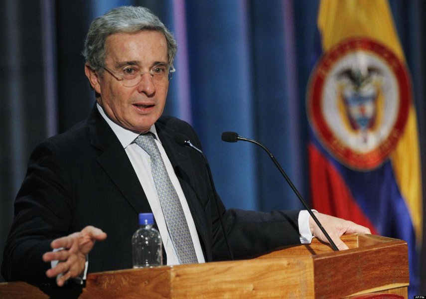 In this photo taken Aug. 26, 2011, former President Alvaro Uribe speaks during a conference about terrorism at the Nueva Granada military university in Bogota, Colombia. Presidents typically step out of the limelight when their terms end to give their suc