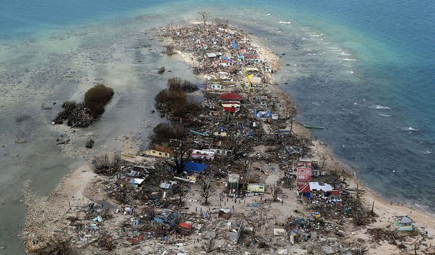An aerial view of a coastal town, devastated by super Typhoon Haiyan, in Samar province in central Philippines November 11, 2013. Dazed survivors of super Typhoon Haiyan that swept through the central Philippines killing an estimated 10,000 people begged 