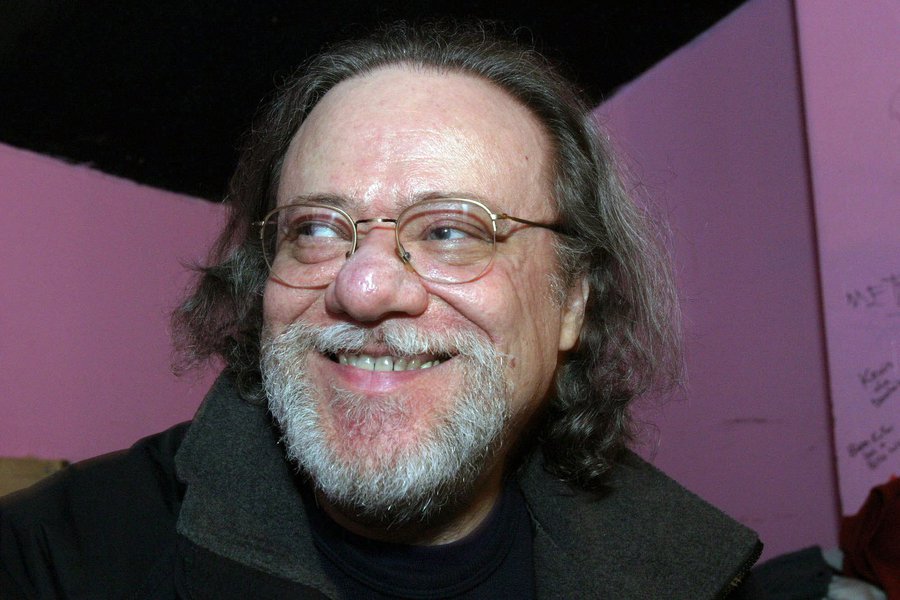 FILE - In this Jan. 8, 2005, file photo, Tommy Ramone, ex-drummer and manager of The Ramones, smiles as he is interviewed backstage at the Knitting Factory in New York. A business associate says Ramone, a co-founder of the seminal punk band The Ramones an