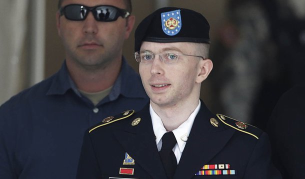 U.S. Army Private First Class Bradley Manning (C) departs the courthouse at Fort Meade, Maryland July 30, 2013. A military judge on Tuesday found Manning not guilty of aiding the enemy - the most serious charge among many he faced for handing over documen