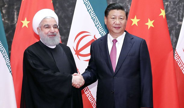 新华社照片，青岛，2018年6月10日 习近平同伊朗总统鲁哈尼举行会谈 6月10日，国家主席习近平在青岛同伊朗总统鲁哈尼举行会谈。 新华社记者丁林摄