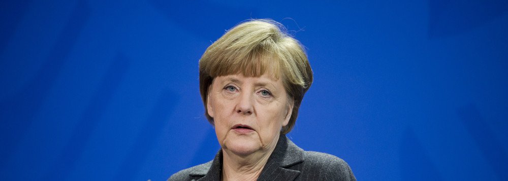 German Chancellor Angela Merkel addresses the media during a joint press conference as part of a meeting with Prime Minister of Singapore Lee Hsien Loong at the chancellery in Berlin, Germany, Tuesday, Feb. 3, 2015. (AP Photo/Steffi Loos)