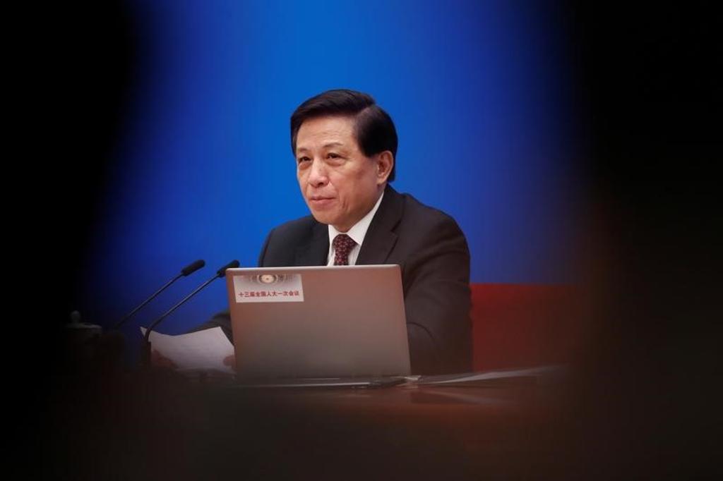 Zhang Yesui, a spokesman for National People's Congress (NPC), addresses reporters ahead of China's annual session of parliament at the Great Hall of the People in Beijing, China March 4, 2018. REUTERS/Damir Sagolj
