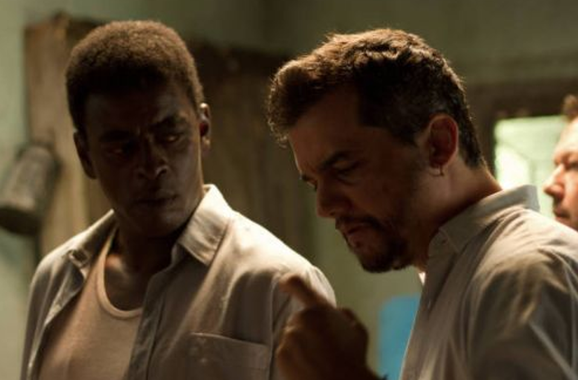 Dirigido por Wagner Moura, o filme  abordará a trajetória do guerrilheiro urbano que se tornou um dos principais expoentes de resistência contra a ditadura militar; logo no início das gravações, o diretor Wagner Moura se deparou com ameaças de direitistas nas redes sociais, que prometiam invadir o set de gravações – o que não ocorreu, de acordo com o ator, graças ao apoio de 15 jovens de uma frente antifascista, que garantiram a segurança da equipe