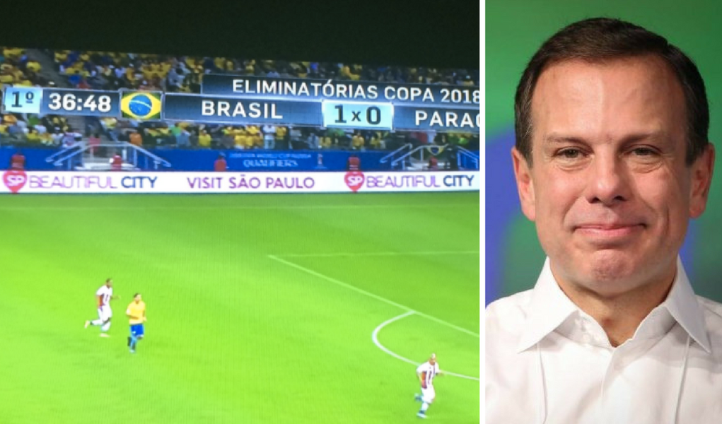 O Ministério Público de São Paulo pediu explicações à Prefeitura de São Paulo sobre a publicidade do programa  Cidade Linda, de João Doria, em jogos da seleção brasileira; resposta deve ser dada em até 30 dias; publicidade teria sido oferecida gratuitamente pelo empresário Sidney Oliveira, dono da rede de farmácias Ultrafarma
