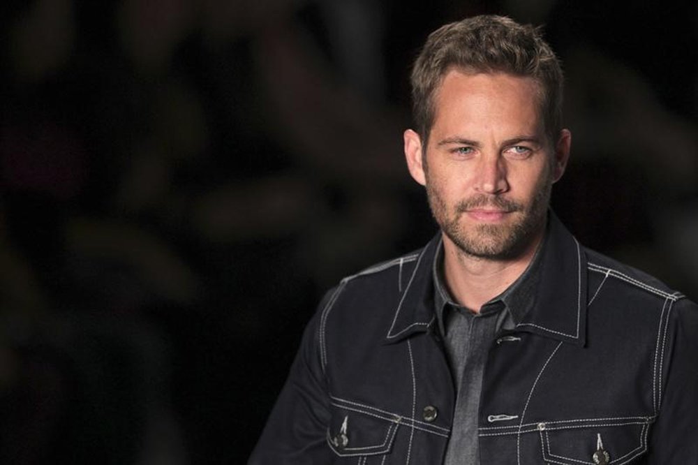 Paul Walker desfilando no São Paulo Fashion Week. 22/03/2013 REUTERS/Filipe Carvalho