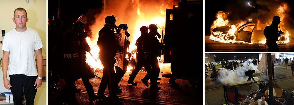 Ao menos 12 prédios foram incendiados em Ferguson, no Estado norte-americano do Missouri, em uma onda de protestos após um júri ter decidido não indiciar um policial branco que matou a tiros um adolescente negro desarmado em agosto, informou a polícia; Michael Brown, de 18 anos, morreu ao ser baleado pelo policial Darren Wilson, em 9 de agosto