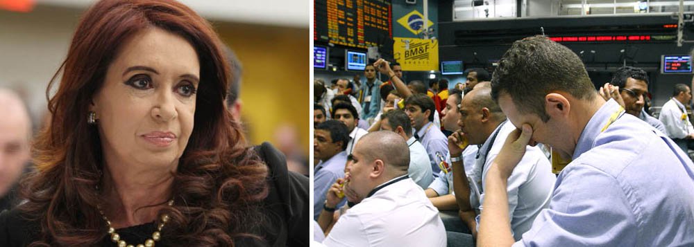 Medida foi anunciada no início da tarde pelo governo de Cristina Kirchner, em razão da fuga de capitais; discurso de Dilma em Davos ressaltou diferenças do Brasil em relação à Argentina, mas, em dia de pânico, todos saíram perdendo; presidente do Banco Central, Alexandre Tombini, disse que acompanha de perto a crise argentina