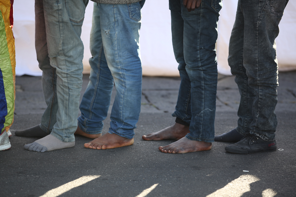 Catania, Sicily, April 23 2015. Over 220 people arrived at 8am by ship at the Sicilian port. Catania RC set up a clinic to offer medical treatment, psychosocial support and counseling along with fresh water and shoes for migrants.
