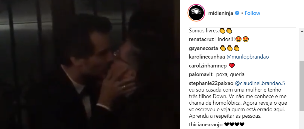 Em primeira aparição após deixar o Brasil, Jean Wyllys beija Wagner Moura