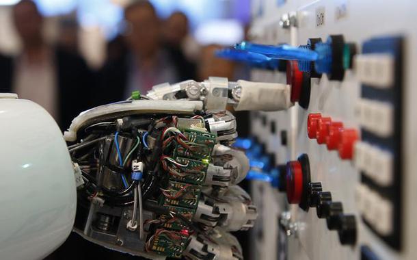 The hand of humanoid robot AILA (artificial intelligence lightweight android) operates a switchboard during a demonstration by the German research centre for artificial intelligence at the CeBit computer fair in Hanover March, 5, 2013. The biggest fair of its kind open its doors to the public on March 5 and will run till March 9, 2013.  REUTERS/Fabrizio Bensch (GERMANY - Tags: POLITICS) - RTR3ELOG