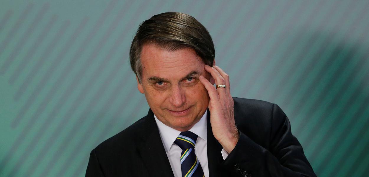 Brazil's President Jair Bolsonaro gestures during inauguration ceremony of the new Education Minister Abraham Weintraub at the Planalto Palace in Brasilia, Brazil April 9, 2019. REUTERS/Adriano Machado