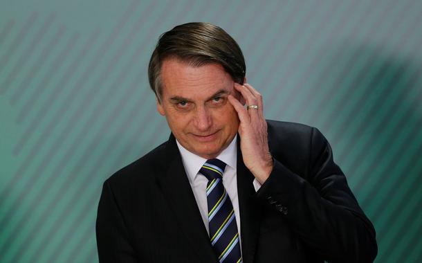 Brazil's President Jair Bolsonaro gestures during inauguration ceremony of the new Education Minister Abraham Weintraub at the Planalto Palace in Brasilia, Brazil April 9, 2019. REUTERS/Adriano Machado