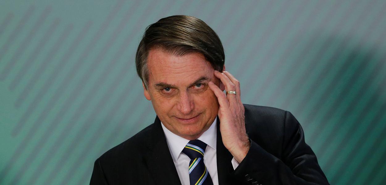 Brazil's President Jair Bolsonaro gestures during inauguration ceremony of the new Education Minister Abraham Weintraub at the Planalto Palace in Brasilia, Brazil April 9, 2019. REUTERS/Adriano Machado