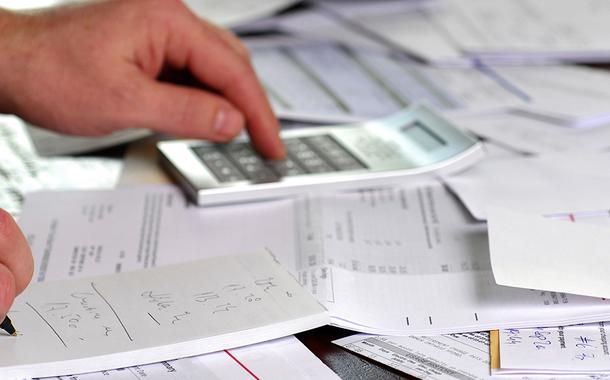 A large amount of bills spread all over the place