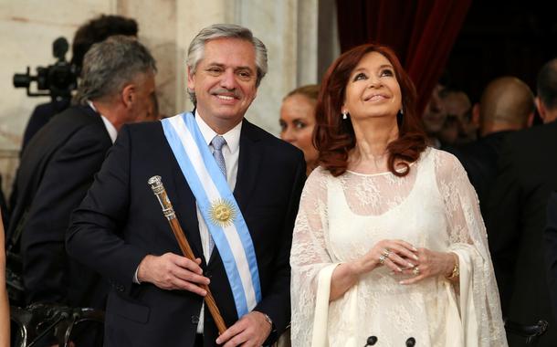 Argentina's President Alberto Fernandez holds the symbolic leader's staff, next to new Vice President Cristina Fernandez de Kirchner, after he was sworn in as Argentina's next president, in Buenos Aires, Argentina December 10, 2019. REUTERS/Agustin Marcarian