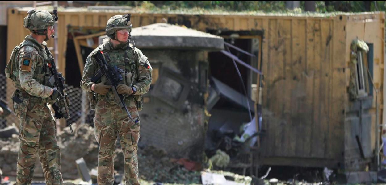 Foreign troops with NATO-led Resolute Support Mission investigate at the site of a suicide attack in Kabul, Afghanistan September 5, 2019