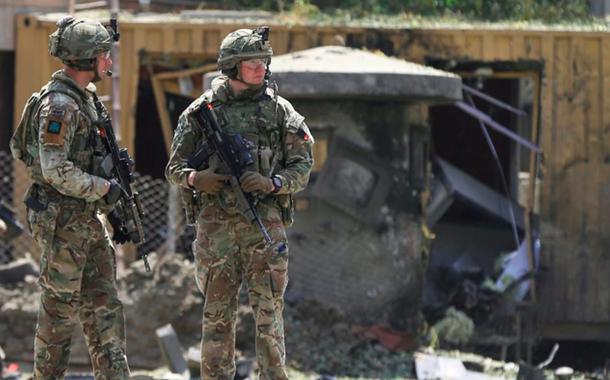 Foreign troops with NATO-led Resolute Support Mission investigate at the site of a suicide attack in Kabul, Afghanistan September 5, 2019