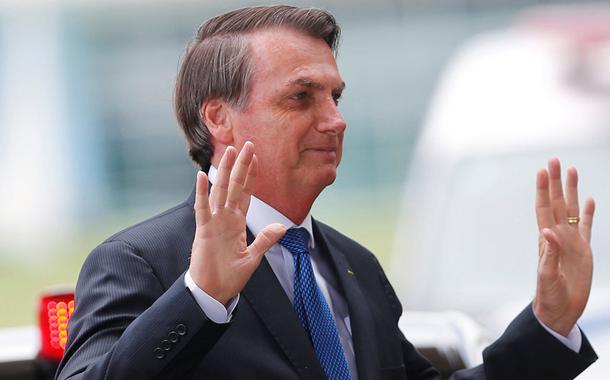 Brazil's President Jair Bolsonaro gestures as he leaves the Alvorada Palace in Brasilia, Brazil December 12, 2019. REUTERS/Adriano Machado