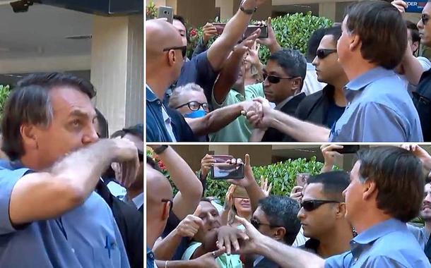 Jair Bolsonaro limpa o nariz e cumprimenta apoiadores