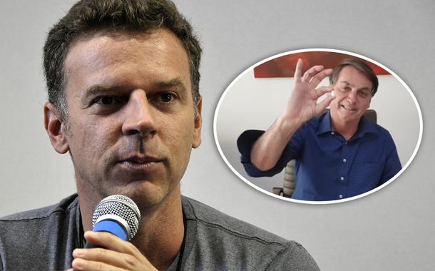 Eduardo Moreira e Jair Bolsonaro mostrando um comprimido de cloroquina