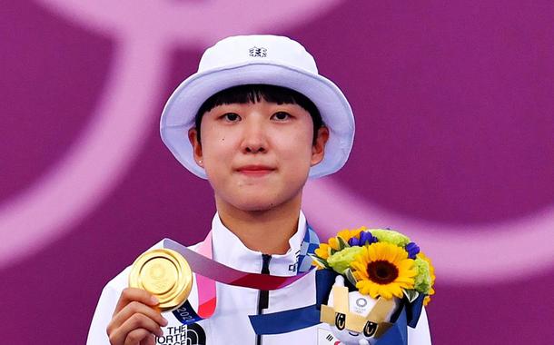 An San of South Korea celebrates on the podium