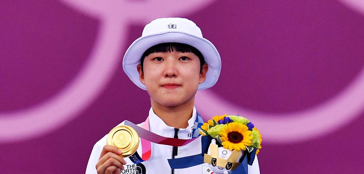 An San of South Korea celebrates on the podium