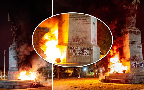 A estátua de Pedro Álvares Cabral, no Largo da Glória, Rio de Janeiro, foi incendiada e pichada em protesto contra o Marco Temporal e a PL490