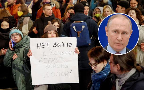 A demonstrator displays a placard during an anti-war protest, after Russian President Vladimir Putin authorized a military operation in eastern Ukraine, in Saint Petersburg, Russia, February 24, 2022. The placard reads: 'No to war in Ukraine! Return the forces home!' REUTERS/Anton Vaganov