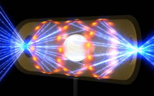 Ilustração fornecida pelo National Ignition Facility, do Lawrence Livermore National Laboratory, mostra um alvo dentro de uma cápsula com feixes de luz entrando em aberturas em cada ponta, ilustrando uma fusão nuclear