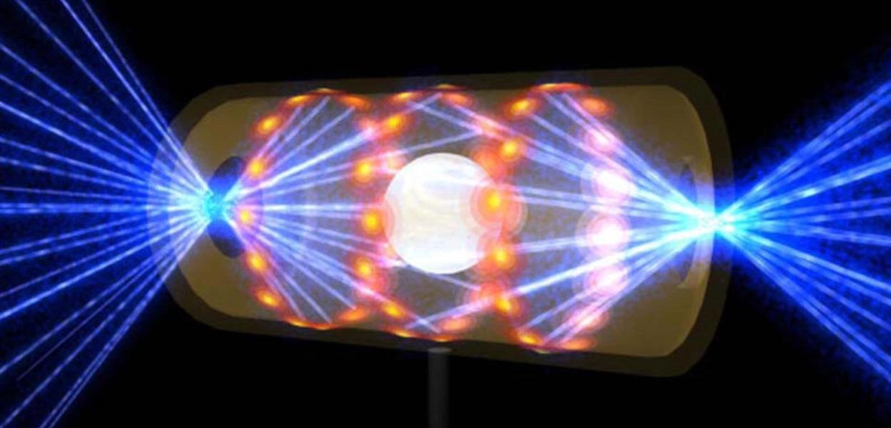 Ilustração fornecida pelo National Ignition Facility, do Lawrence Livermore National Laboratory, mostra um alvo dentro de uma cápsula com feixes de luz entrando em aberturas em cada ponta, ilustrando uma fusão nuclear