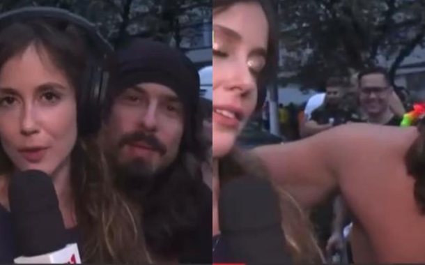 A jornalista Júlia Zaremba ficou visivelmente constrangida após ser surpreendida por trás pelo homem